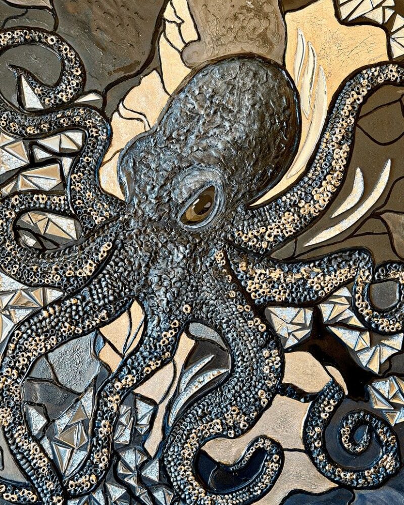 Octopus surrounded by fractured geometric and jewel-like forms