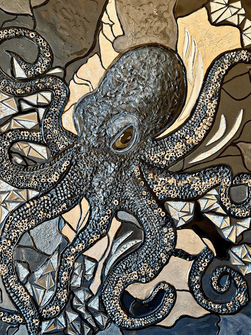 Octopus surrounded by fractured geometric and jewel-like forms